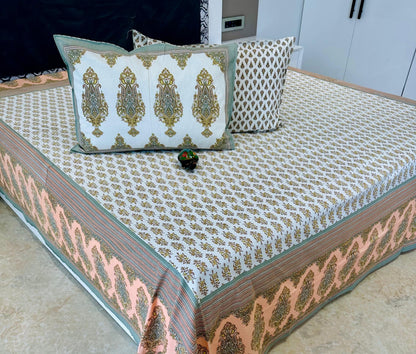Decorative bedspread with intricate patterns on a bed, featuring the 'Shahi Collection' label.